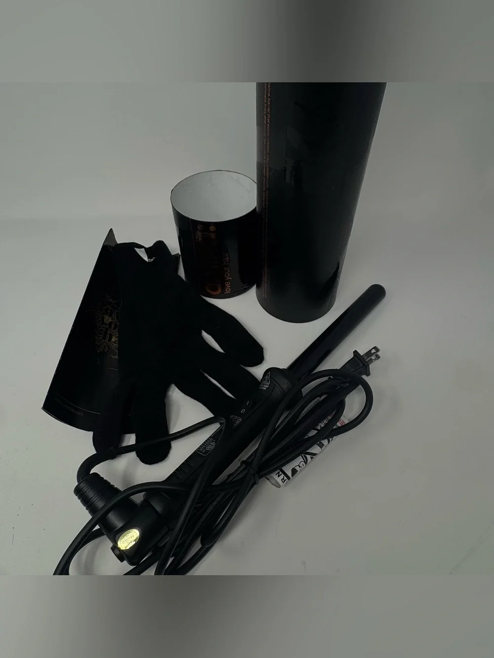 Amika: pro-series tourmaline curler 19mm. Never used. Comes with heat glove.